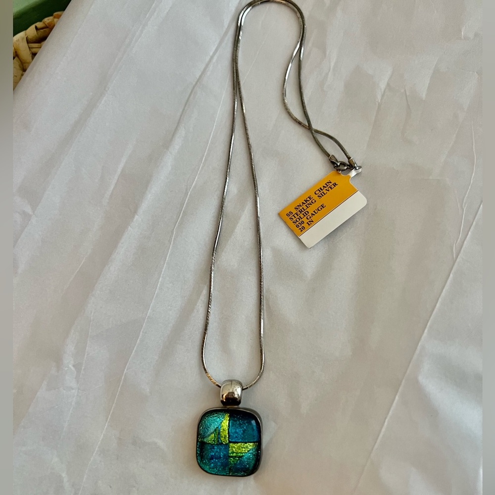20 inch sterling silver chain with dichroic glass pendant.